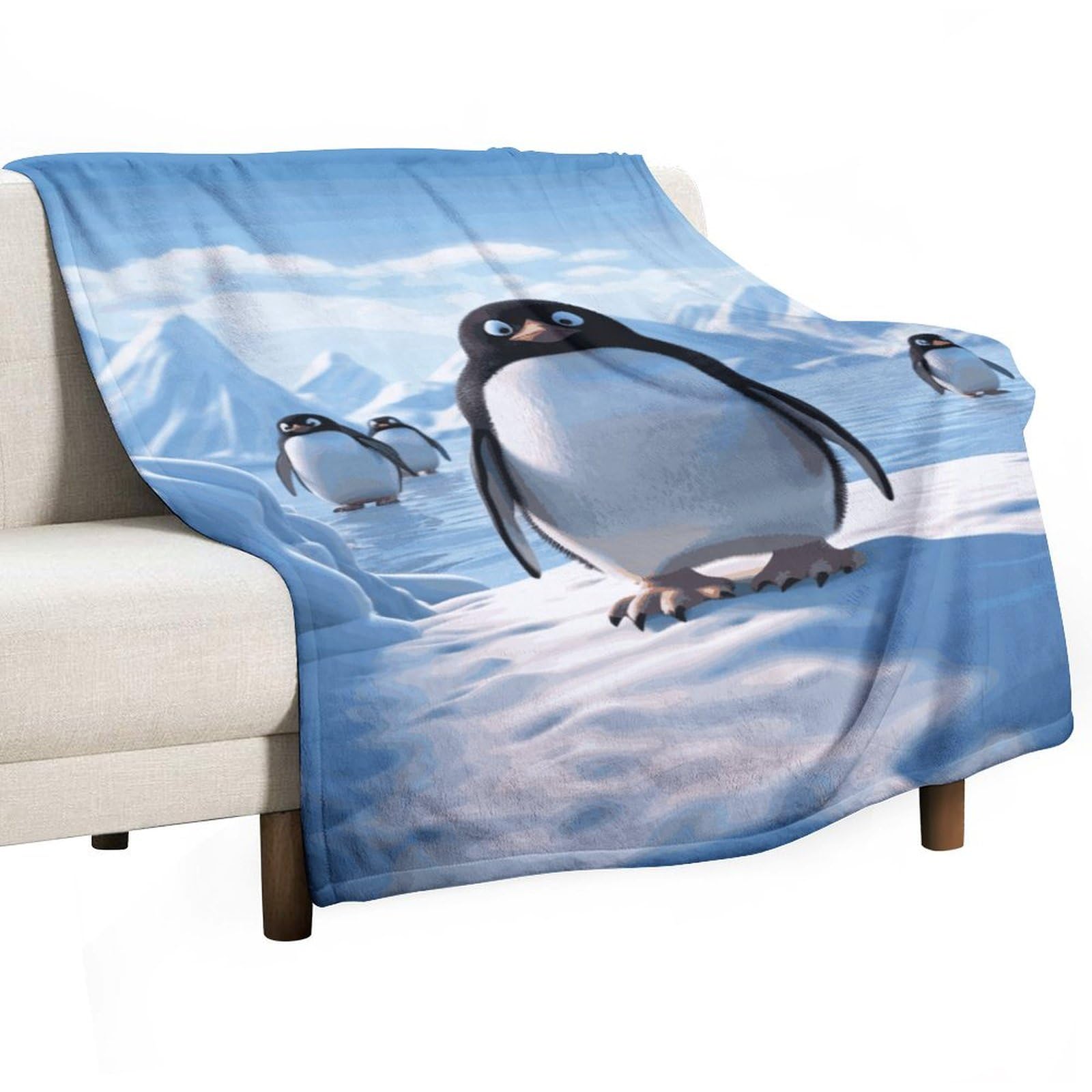 Couverture flanelle pingouin pour soirée cocooning sur le canapé