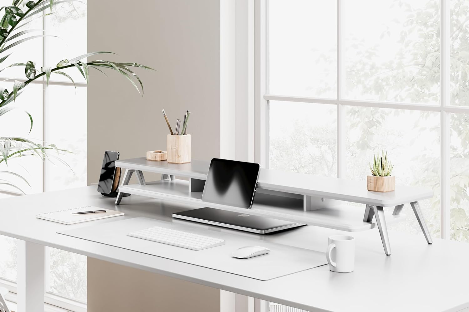 Fenge monitor stand integrated into a modern office setup with a single monitor and organized items