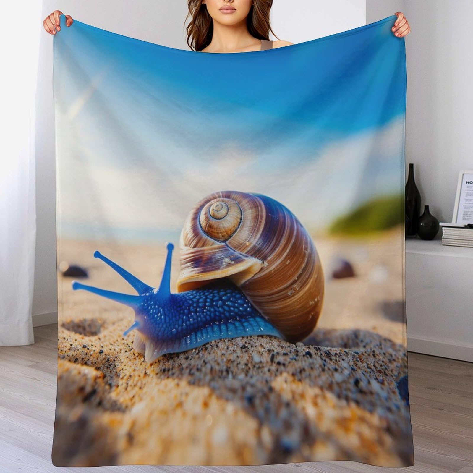 Couverture polaire escargots pour ne plus avoir froid au lit ou au canapé