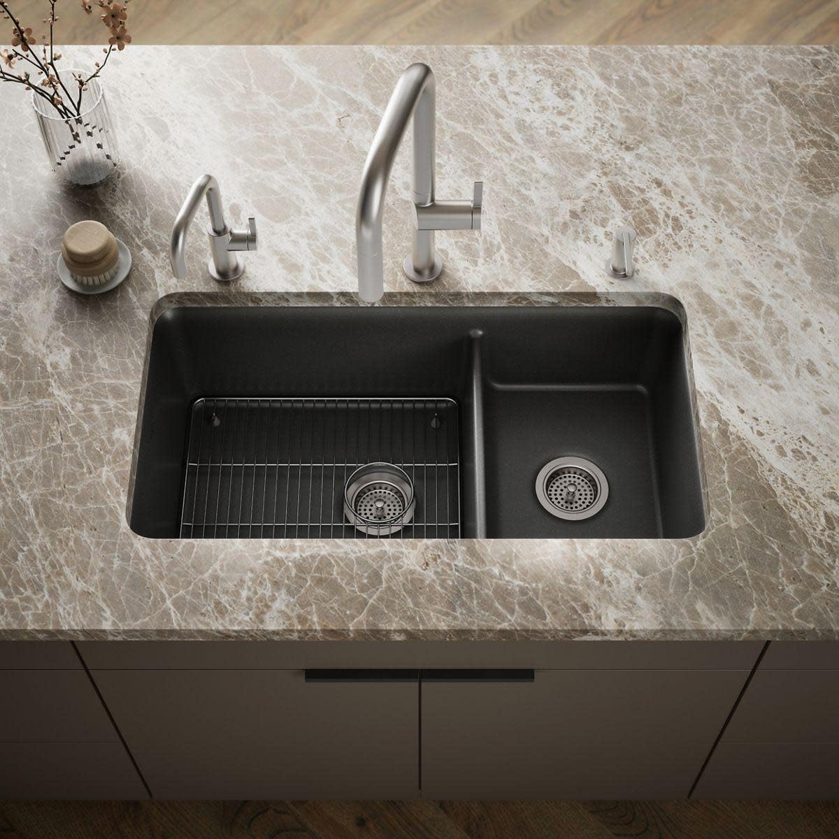 Kohler Cairn double-bowl sink with a sink rack in the larger basin.
