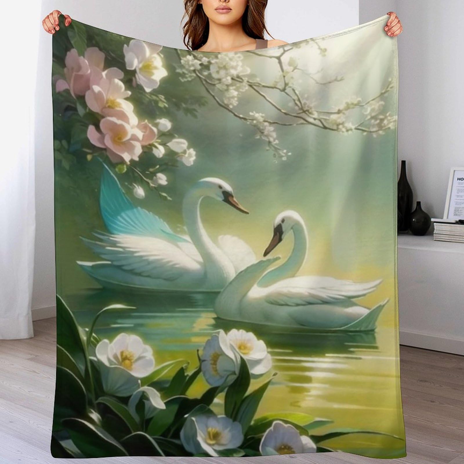 Couverture cygne en flannel pour cocooning sur le canapé-lit du salon