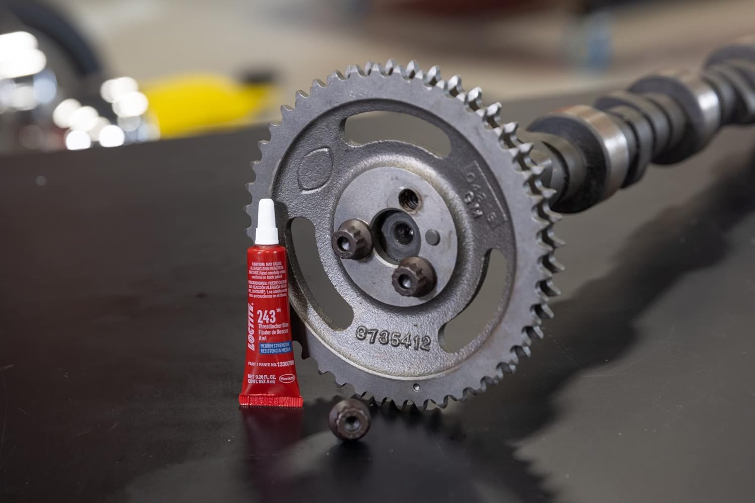 Close-up of Loctite 243 being applied to a bolt thread