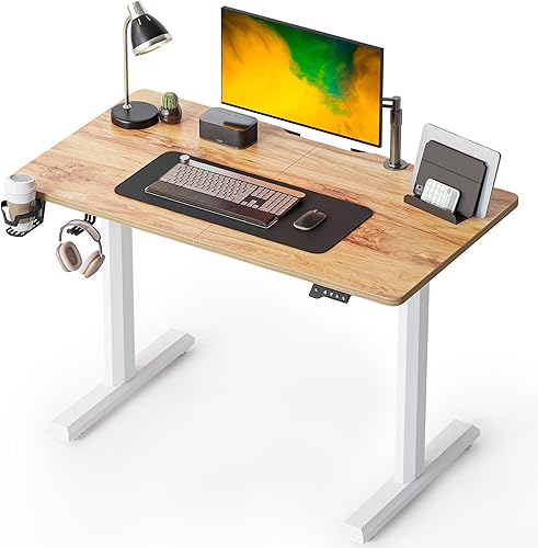 FEZIBO Escritorio eléctrico de pie ajustable en altura, mesa de pie de 44 x 24 pulgadas, escritorio de oficina en casa con tablero de empalme, negro