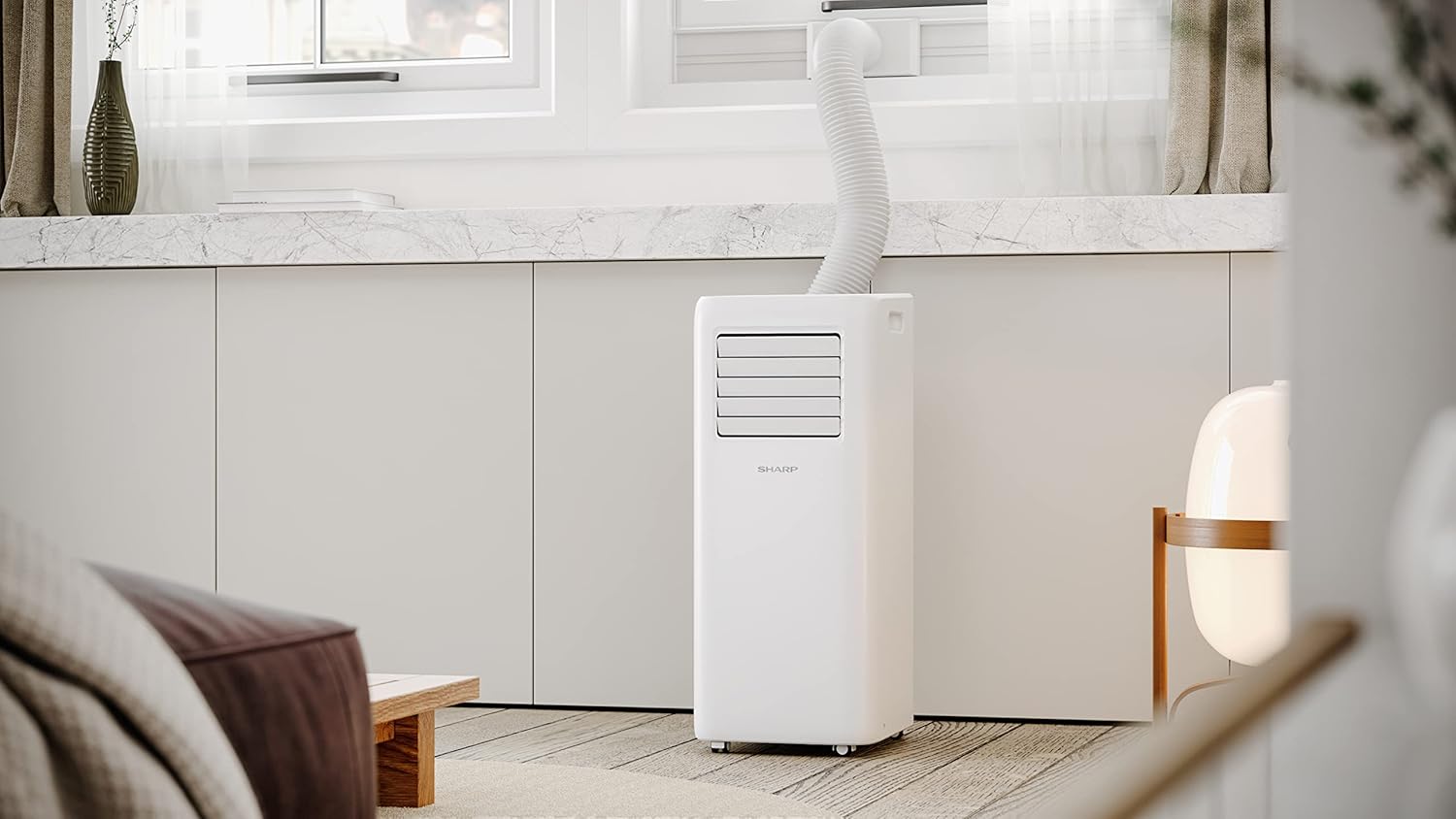 SHARP UL-C09EA-W in a room with exhaust hose installed in window