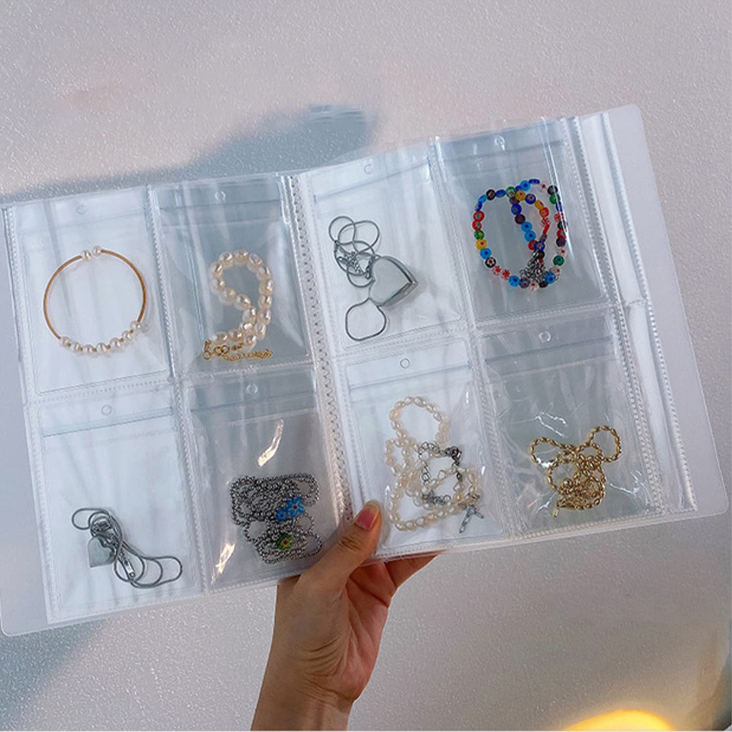 LIPKAHH Jewelry Storage book with pockets,160 Grids 100 PVC Bags Portable Jewelry Storage Book,Transparent travel Jewelry book organizer for Rings,Necklace,Earring organizer Storage Book