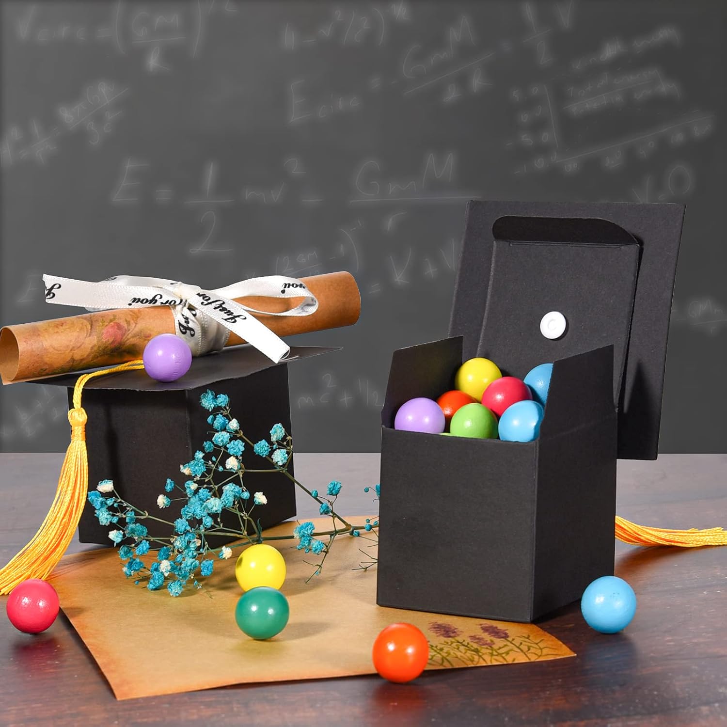 Three-panel image showing the final steps of assembling the graduation candy box: 4) Attaching the tassel to the cap, 5) Attaching the cap to the box, 6) The fully assembled box.