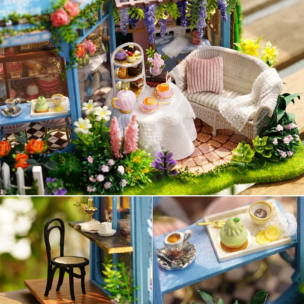 Outdoor seating area of the dollhouse with a miniature table, chairs, and tea set