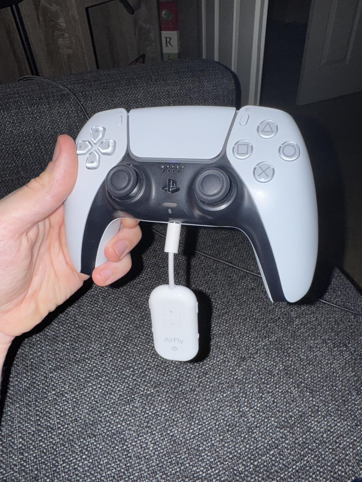 AirFly Pro 2 plugged into a PS5 controller