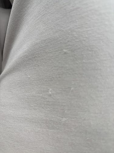 Tiny broken elastic fibers, not piling