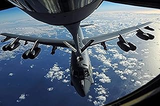 A KC-135 Stratotanker aircraft refuels a B-52 Stratofortress aircraft over the Pacific Ocean Poster Print by Stocktrek Images (17 x 11)