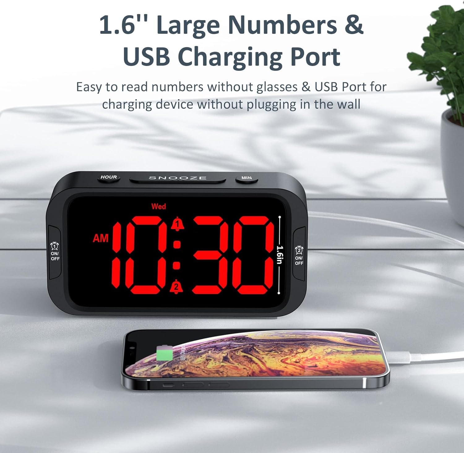 Odokee Digital Dual Alarm Clock with a smartphone connected to its USB charging port.