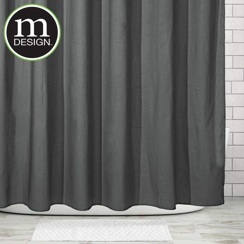 mDesign shower curtain hanging on a rod with rings