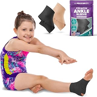 BraceAbility Elastic Ankle Support Brace - Youth Slip on Foot and Ankle Compression Sleeve for Gymnastics, Dance, Kids, Sports, Running, and Sprained Ankle Swelling for Boys and Girls (S - Black)