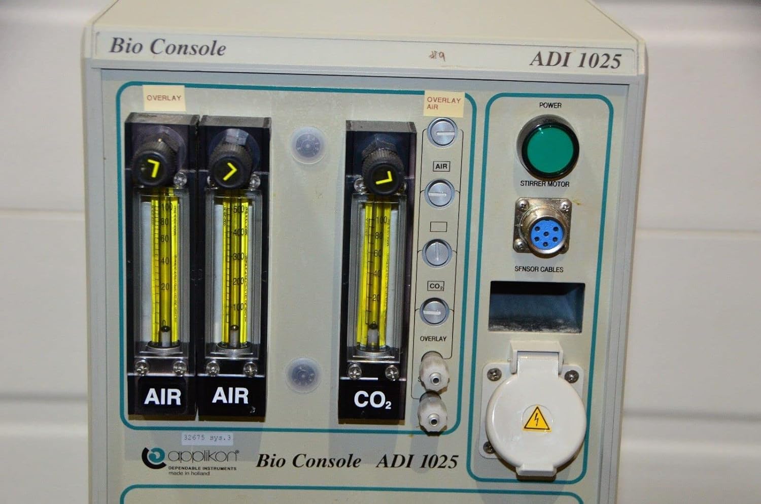 Close-up of the front panel controls including gas flow meters and power button