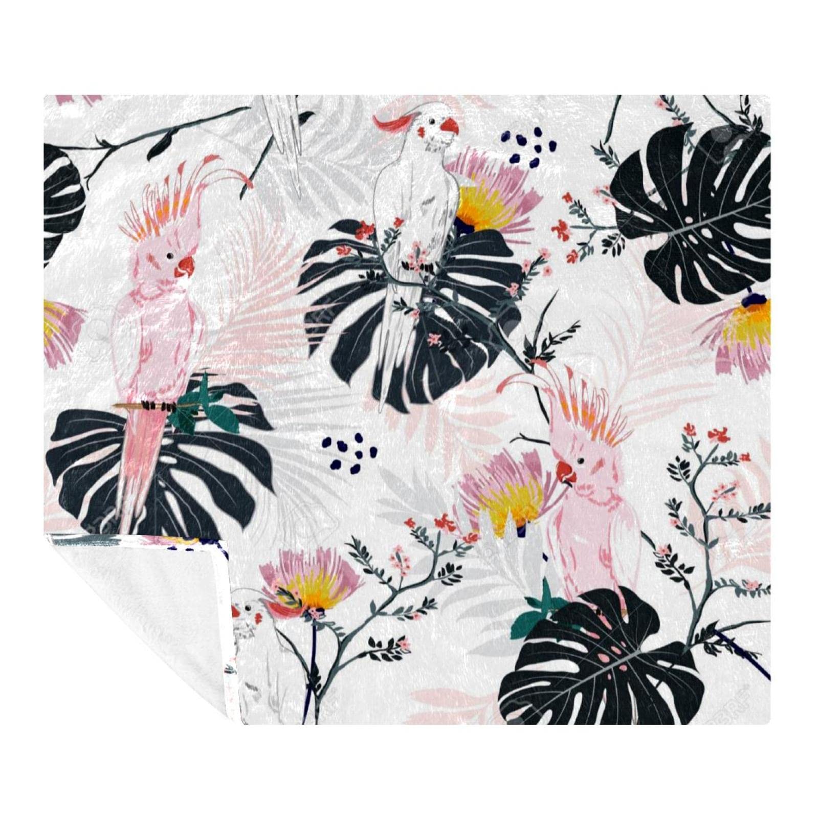 Couverture perroquet et jungle pour un moment cocooning sur votre canapé