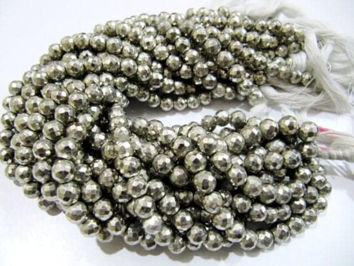 Perles en pyrite naturelle 5.5-6.5mm fil de 25cm facetté de qualité supérieure