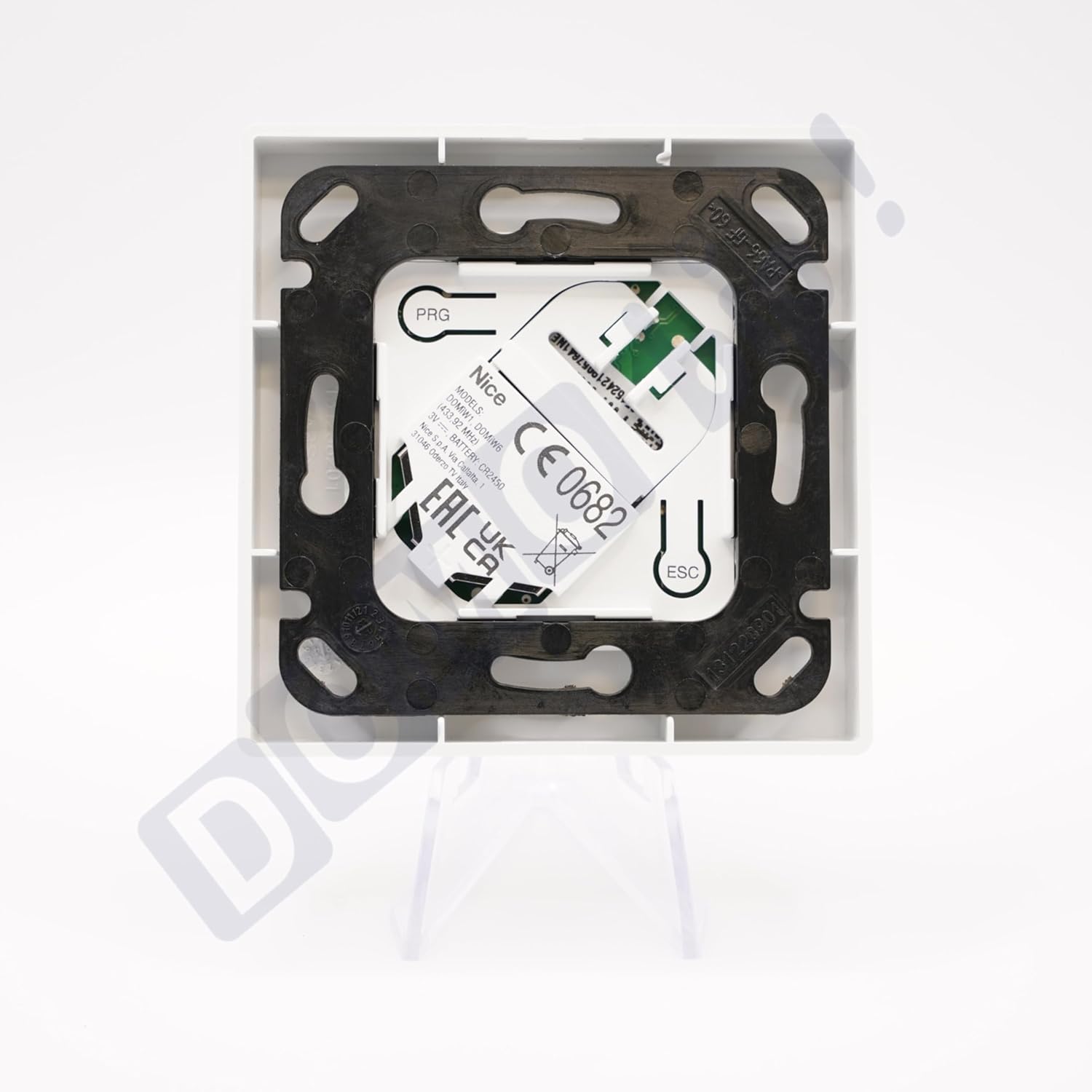 หลัง view of the Nice Domi W1 wall remote control with mounting plate