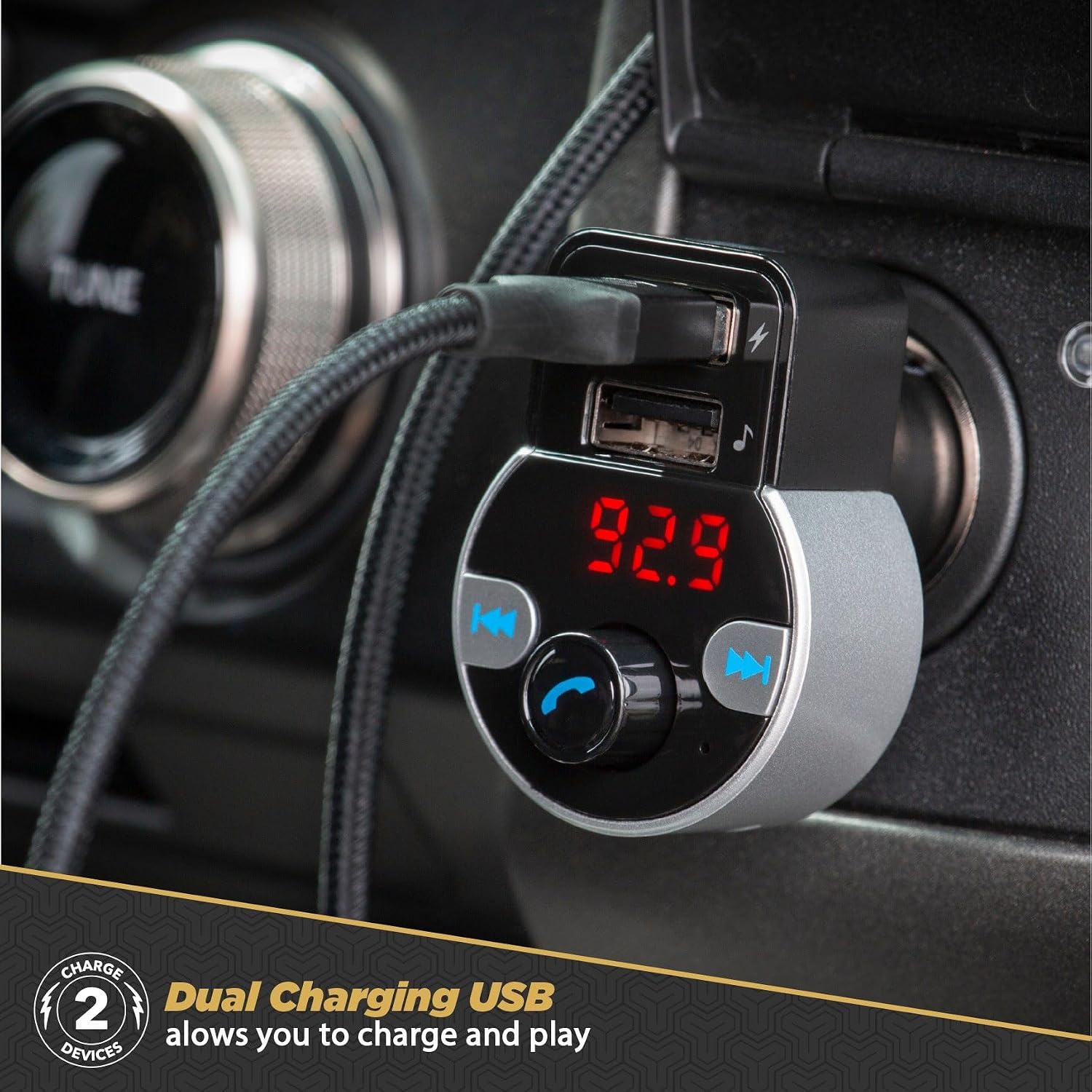 Scosche SBTFM4-XCES0 FM Transmitter plugged into a car's 12V outlet, showing dual USB charging