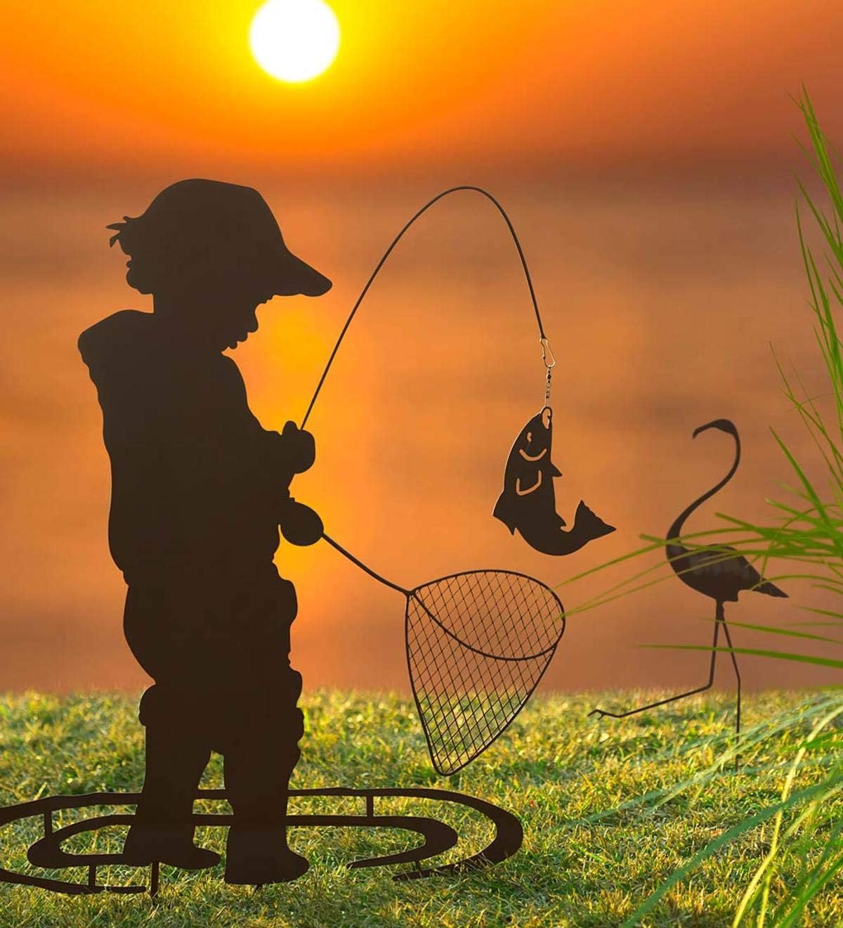 Wind & Weather Boy Fishing Silhouette Metal Garden Stake Handcrafted Black Matte Metal Outdoor Decor Features a Moving Fish Detail Built-in Stakes for Easy Placement 26" L x 0.5" W x 36" H