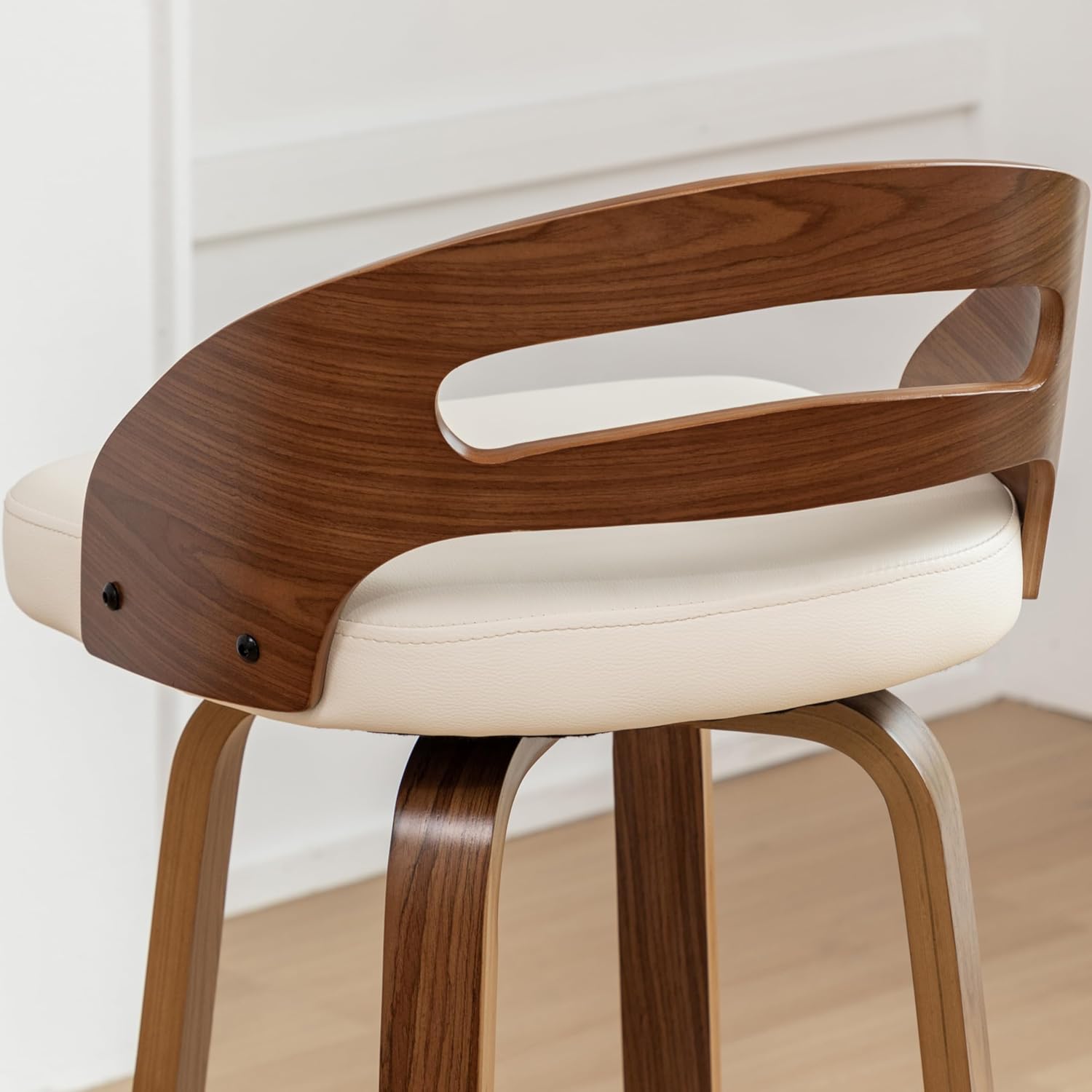 Close-up of the bar stool's seat and backrest, highlighting the 360-degree swivel function.