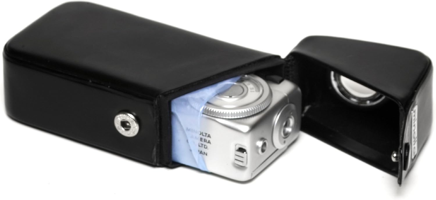 Minolta 16-MG camera being placed into its open leather case