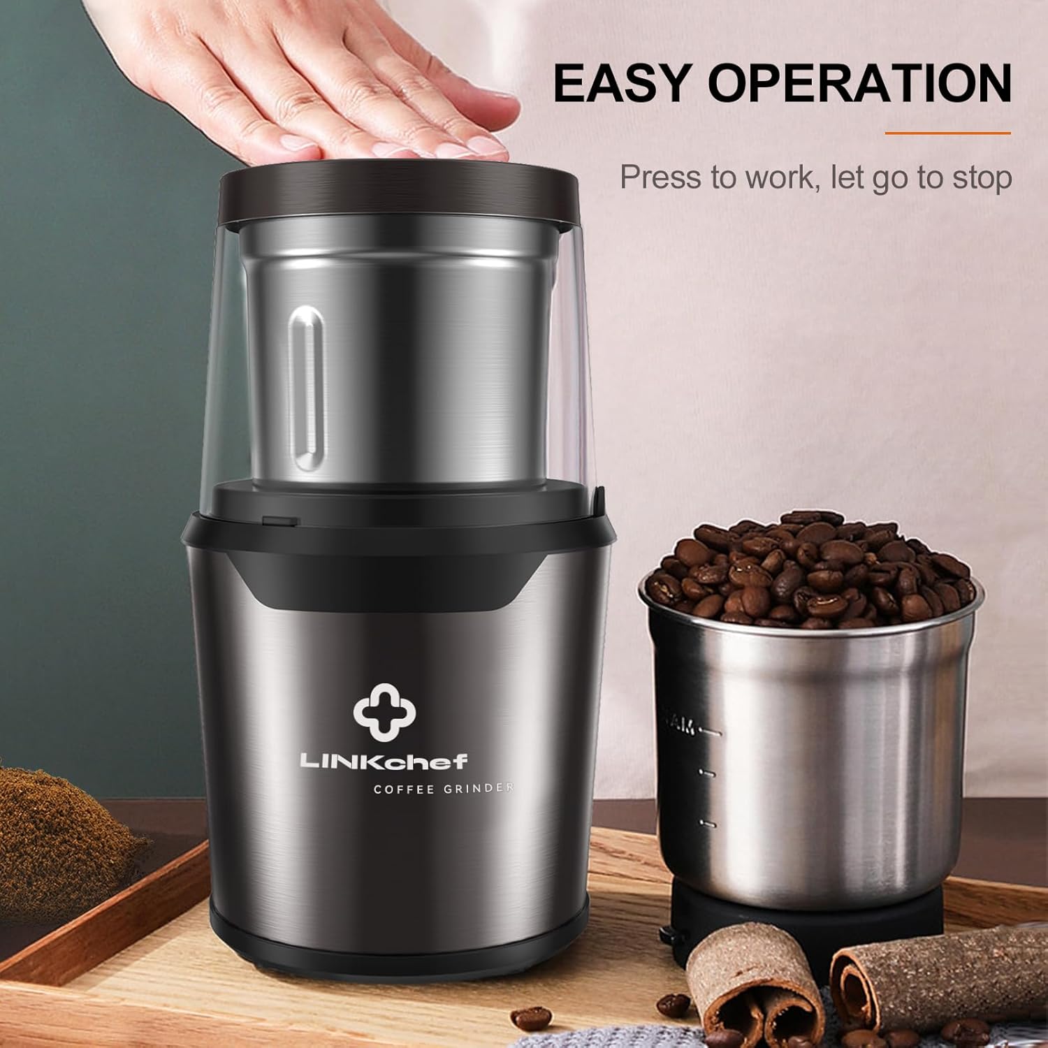 Image showing a hand pressing down on the lid of the LINKchef grinder to operate it.