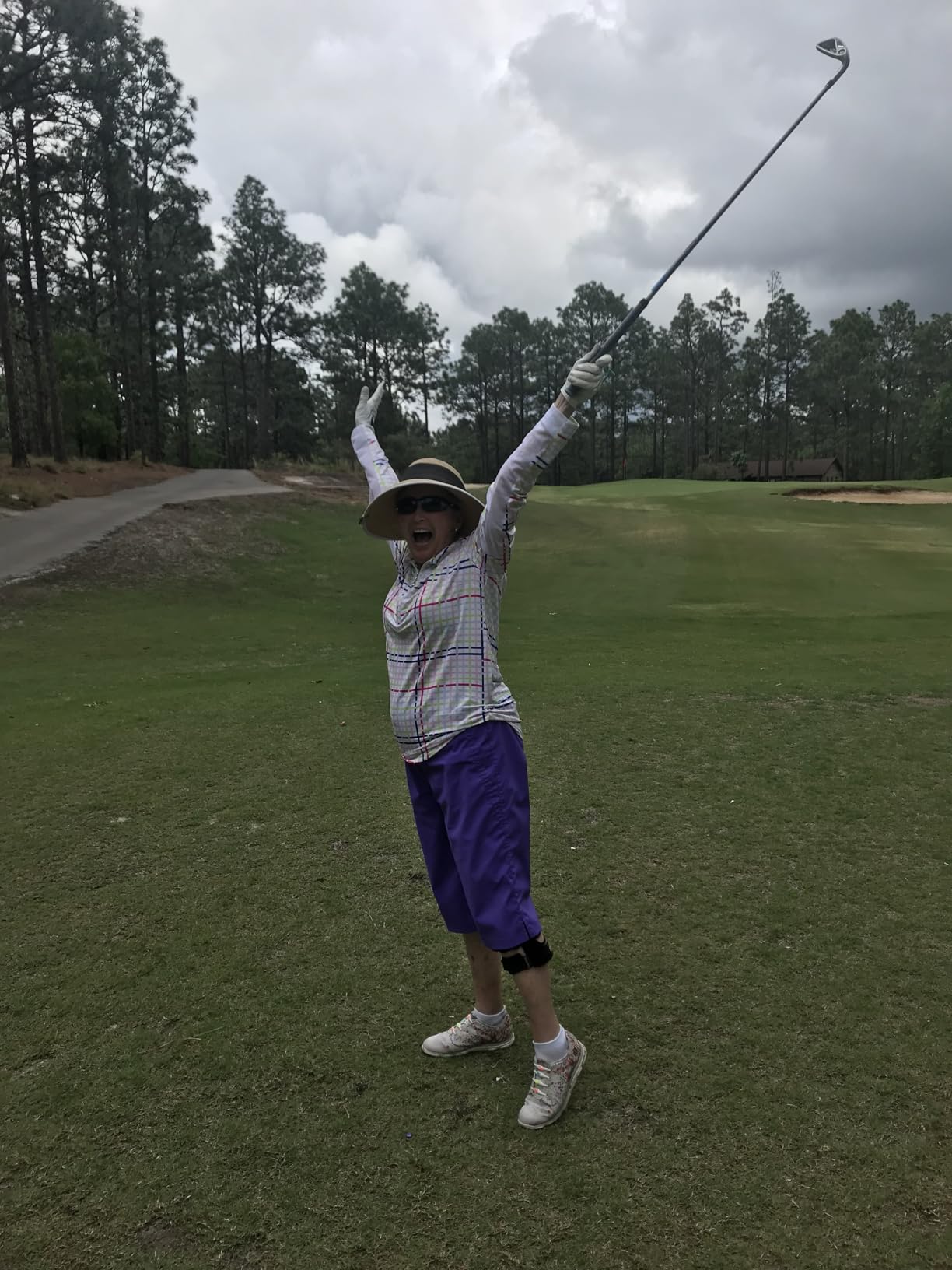 GOLFBUDDY Voice 2S+ clipped to visor