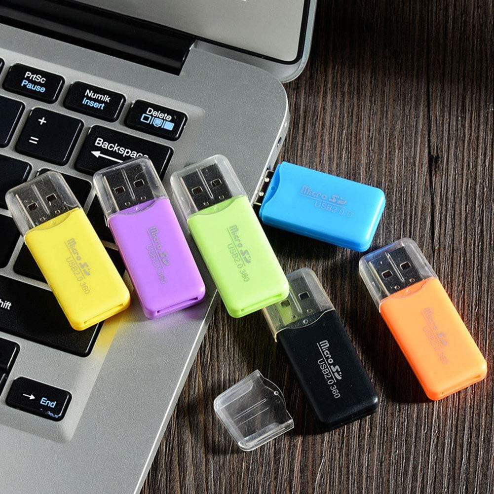 Multiple VizGiz Micro SD Card Readers plugged into the USB ports of a laptop, demonstrating usage.