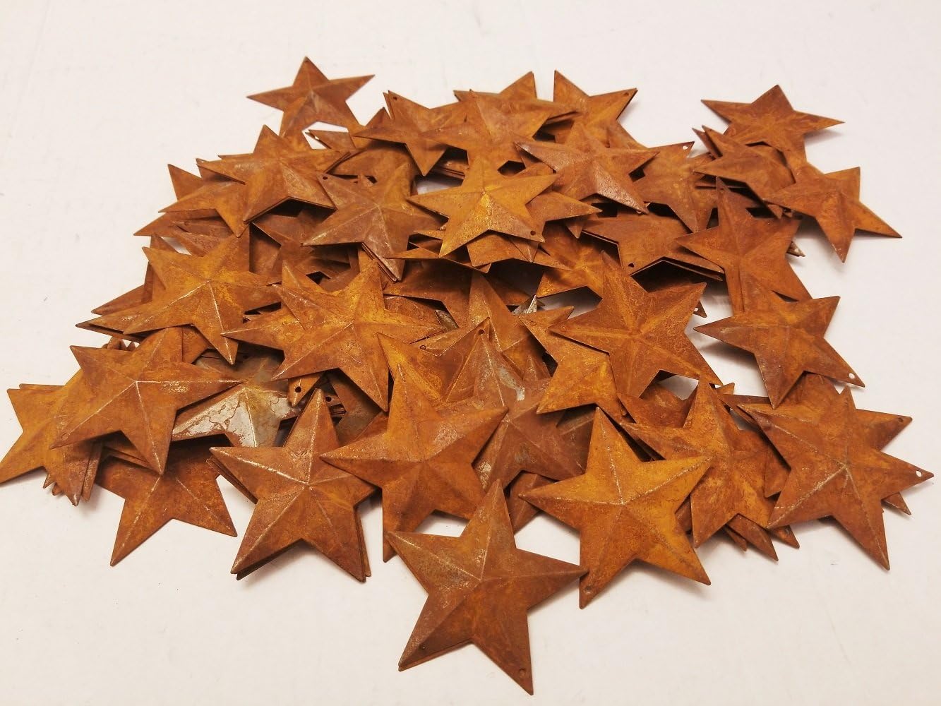 Group of 100 2 1/4" Rusted Metal Stars with Hole for Decorating and Finishing