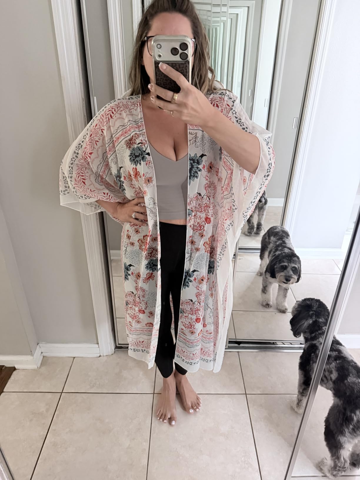 Flowy kimono style cardigan in floral rayon fabric hanging open on a mannequin