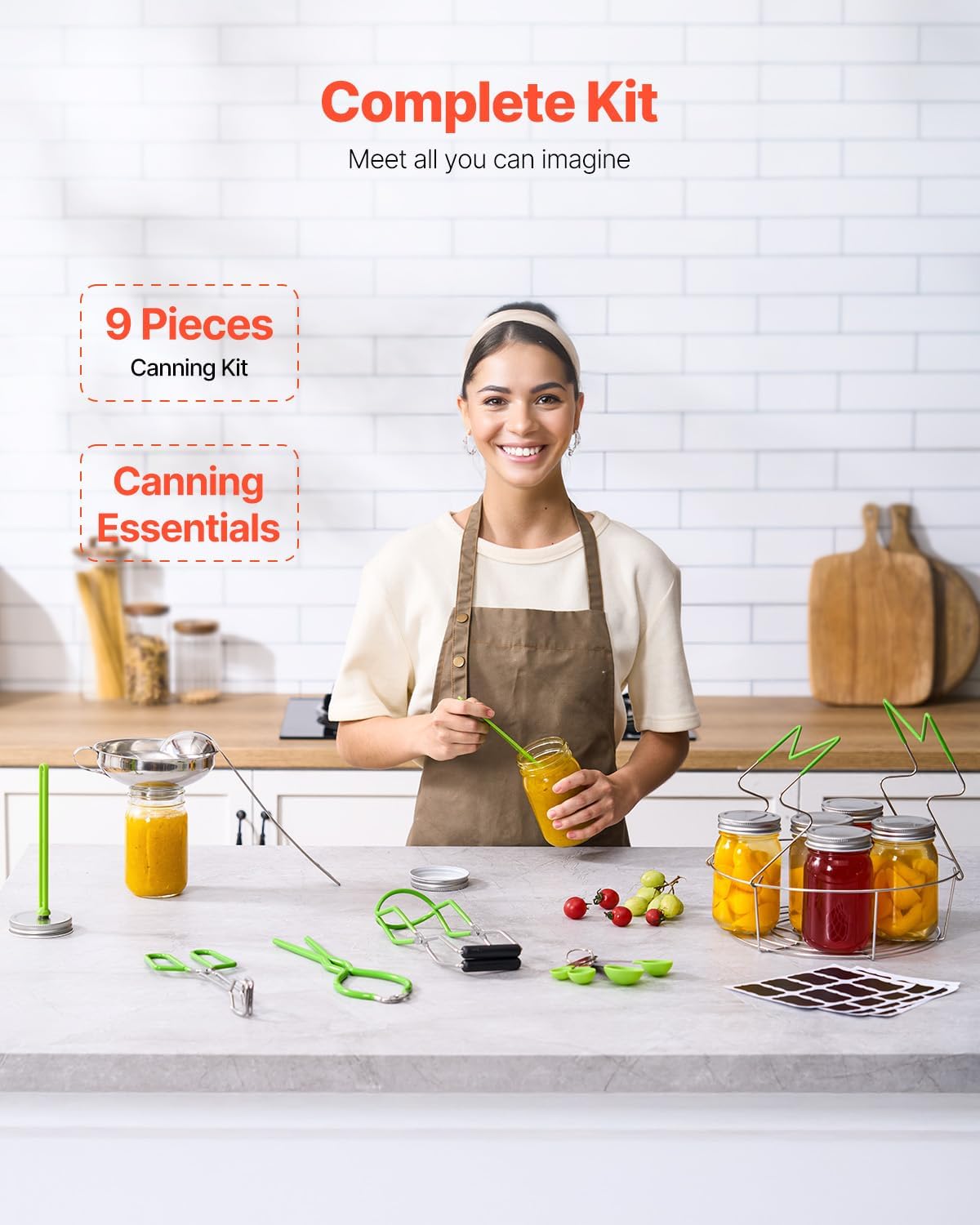 A person smiling while using the VEVOR canning kit, with various tools and jars of preserved food on a kitchen counter.