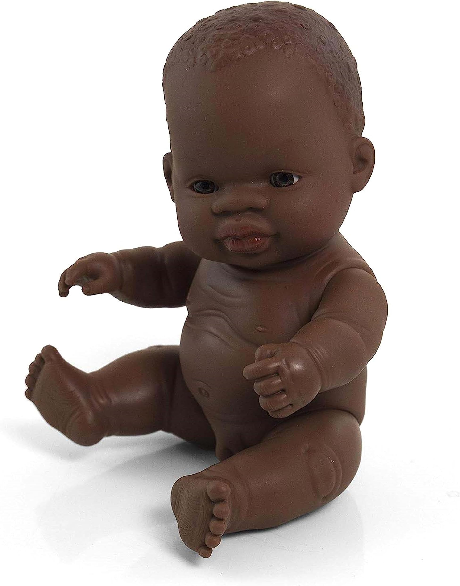 Miniland African boy doll without underwear in bag is soft vinyl, resilient and flexible. 21cm
