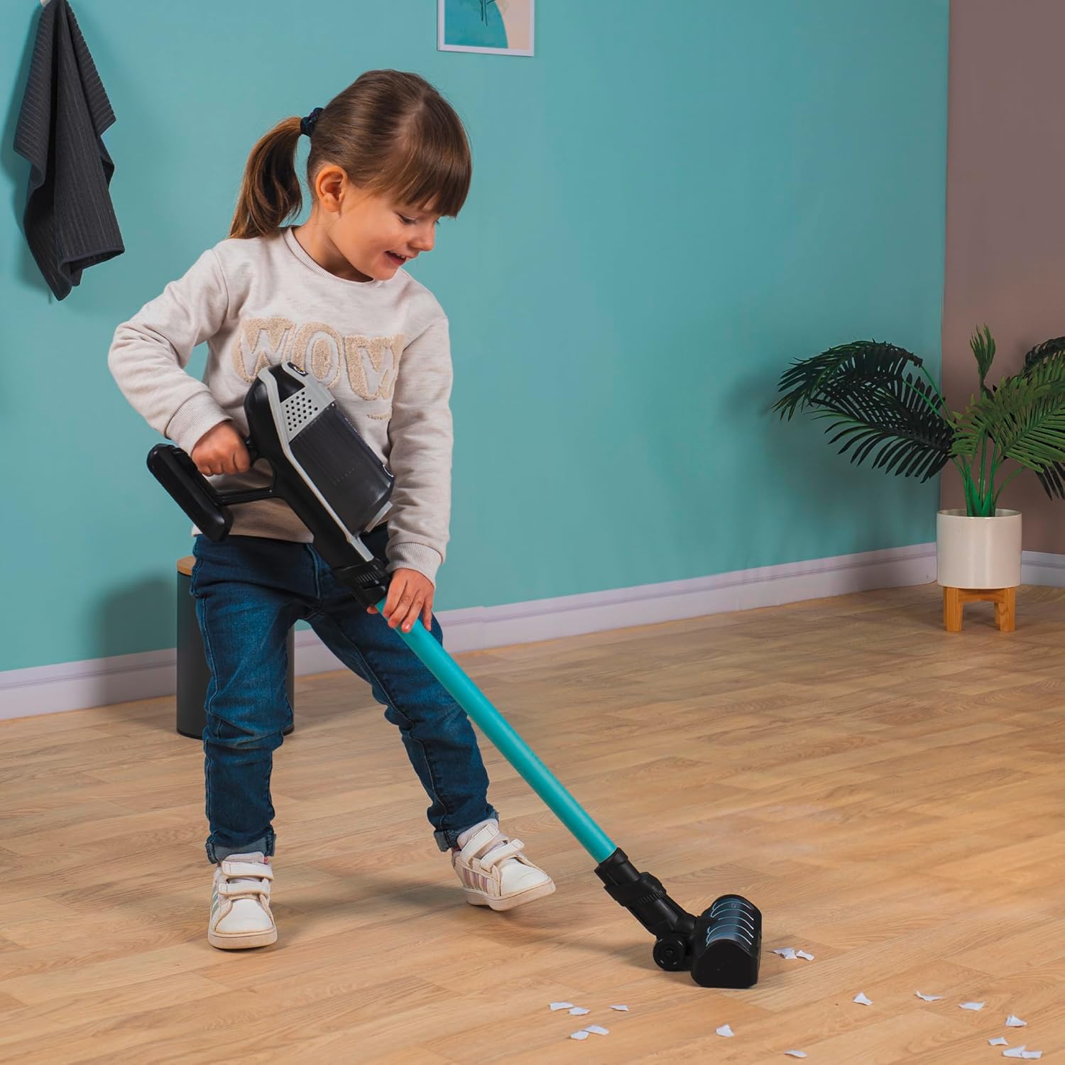 Child playing with the Smoby Rowenta X Force Flex stick vacuum