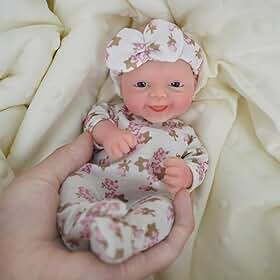 Boneca Bebê Reborn de Silicone Sólido Menina Macio 20cm Olhos Azuis