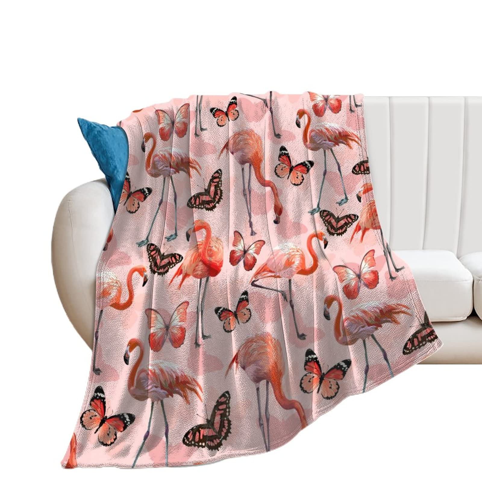 Couverture polaire flamant papillon contre le froid sur votre canapé