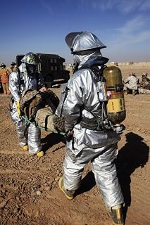 Posterazzi Firefighters move a casualty to a triage area at Camp Dwyer Afghanistan Poster Print, (11 x 17)