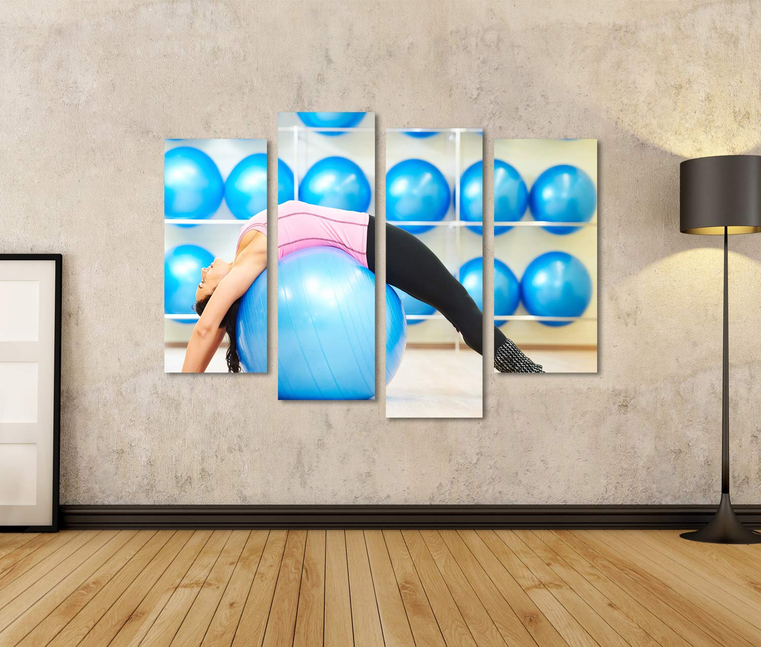 islandburner Tableau sur toile Femme Fait des étirements sur le ballon de fitness pendant les exercices de Pilates dans SPOR Images murales Poster