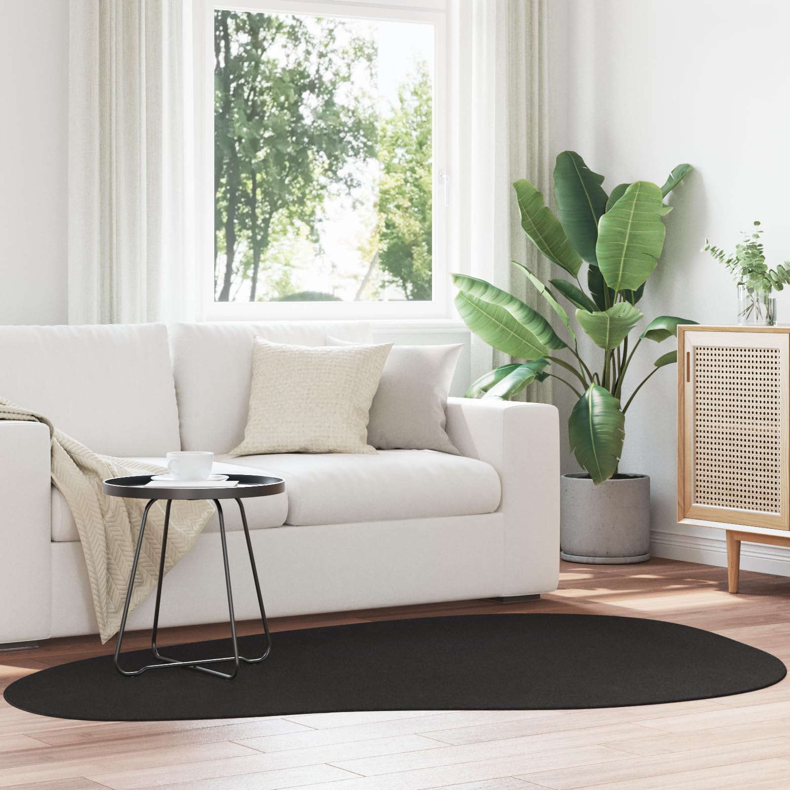 Tapis ovale noir HUARTE 140x200cm en polypropylène moderne