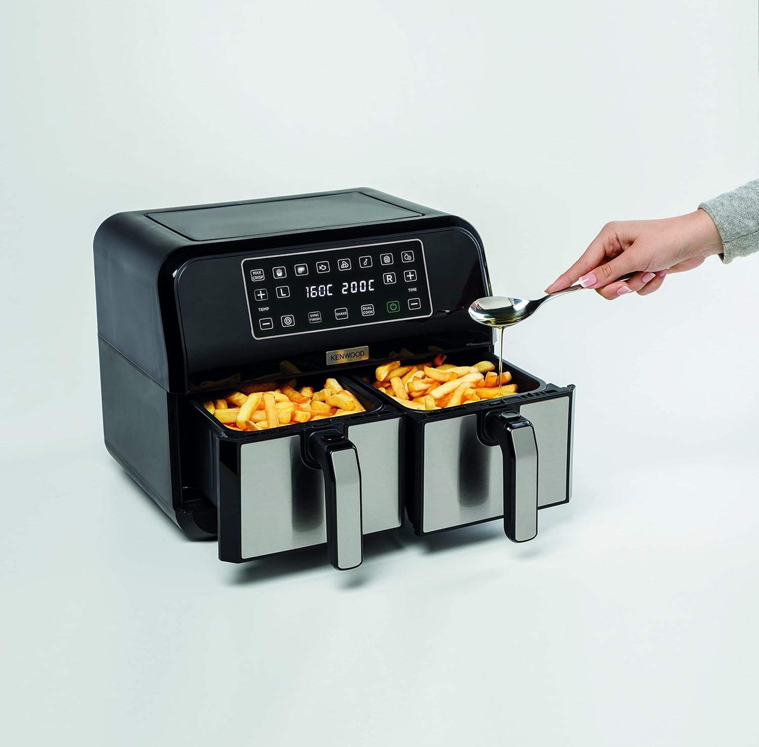 Kenwood Digital Twin Air Fryer with both cooking baskets and crisper plates removed, showing the interior.