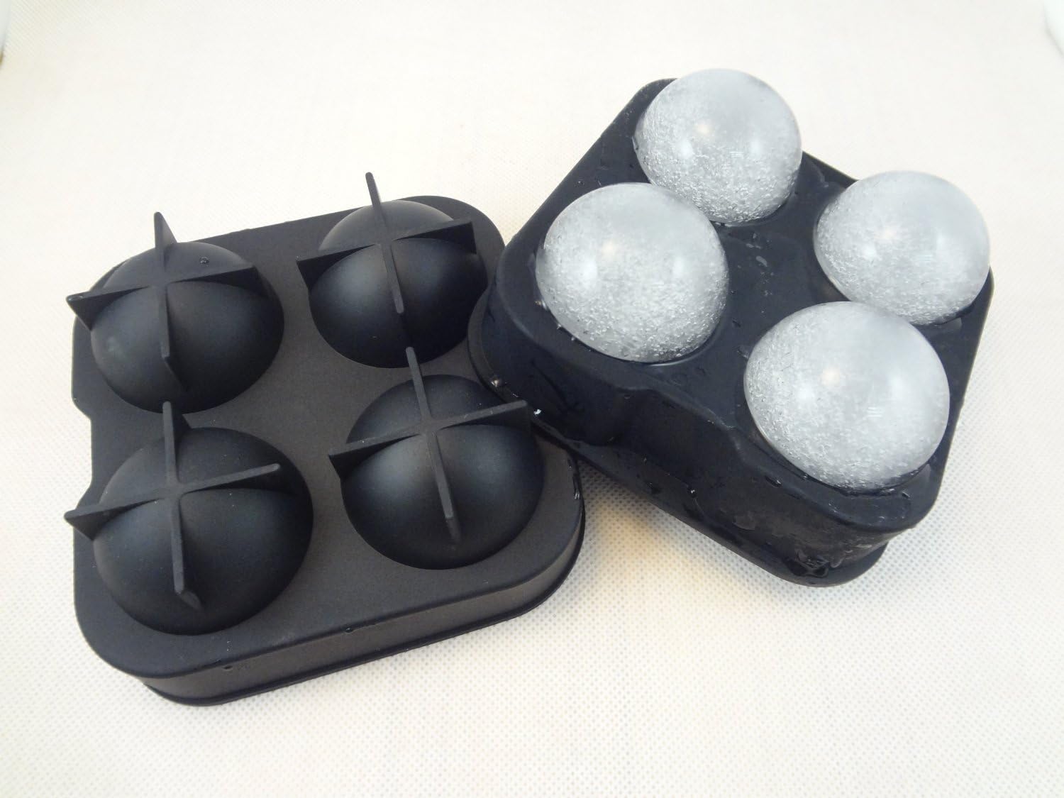 GLACIER STONES SPHERICAL ICE BALL MAKER. CLASSIC BLACK SILICONE ICE BALL MOLD WITH 4 X 2" BALL CAPACITY TRAY.