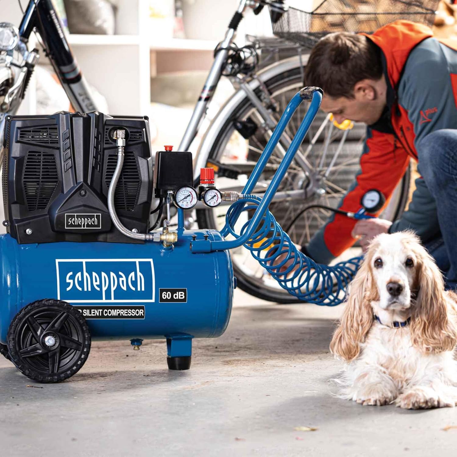 Scheppach HC25si compressor being used to inflate a bicycle tire.
