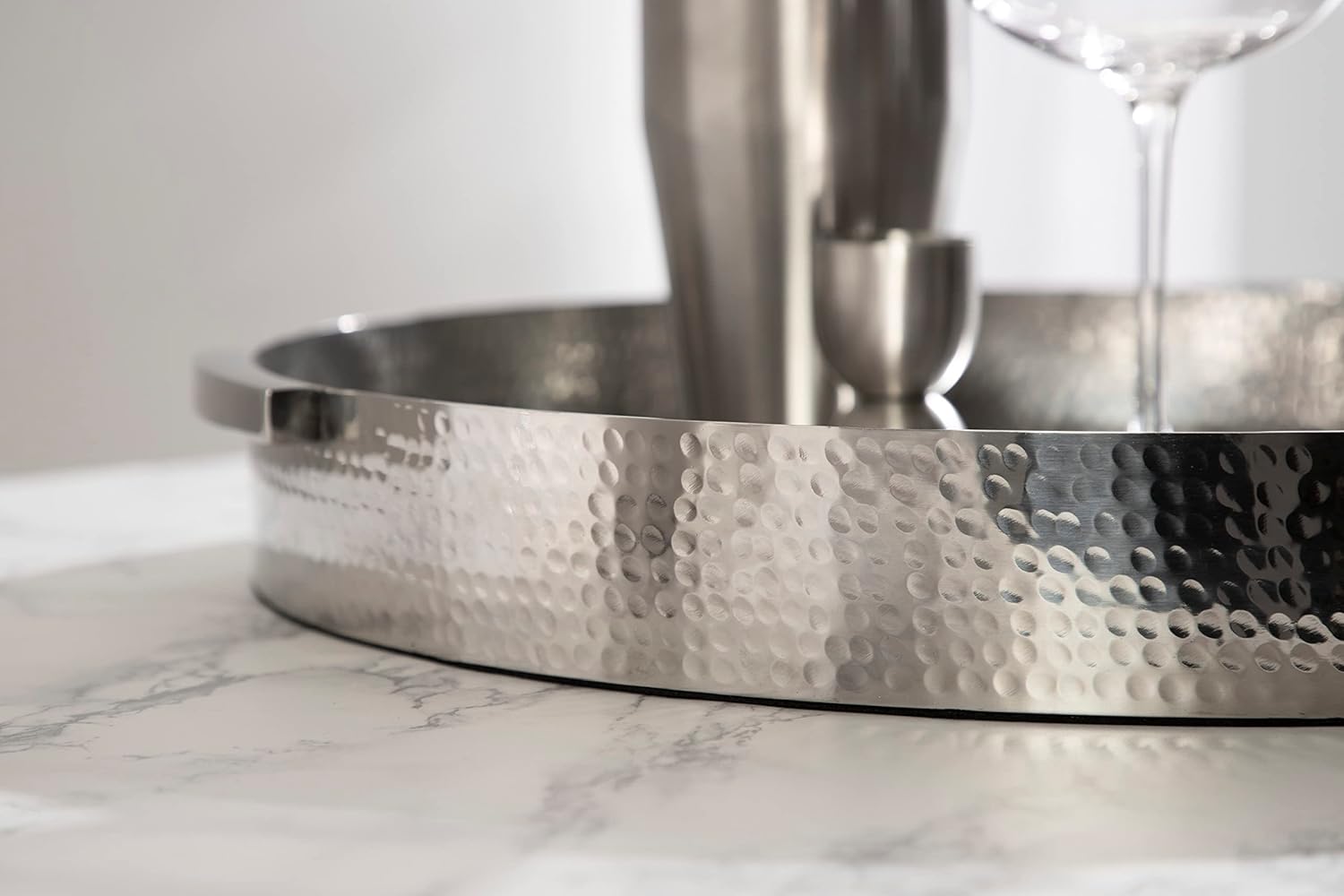 Kate and Laurel Samana Modern Glam Round Metal Tray; 16 Inch Diameter; Silver; Circular Polished Stainless Steel Decorative Tray with Hammered Surface and Minimalist Handles