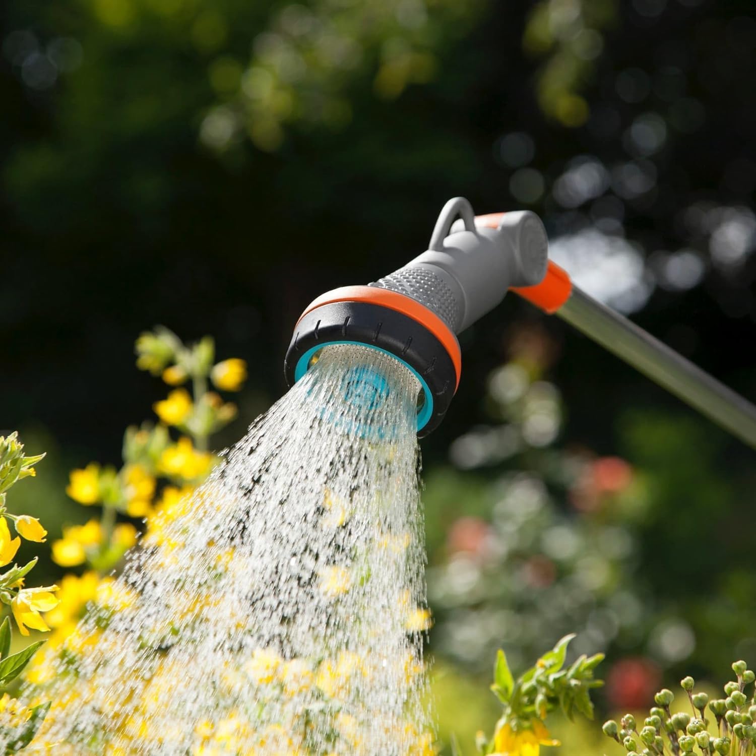 Gardena Comfort Spray Lance in use with soft spray on flowers