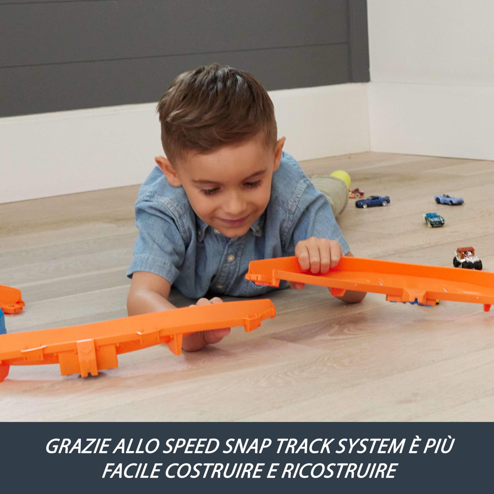 Hot Wheels - Boosted Jump Speedway, set pista con box deluxe da costruire e booster motorizzato, macchinina in scala 1:64 inclusa, giocattolo per bambini, 5+ anni, JDB49
