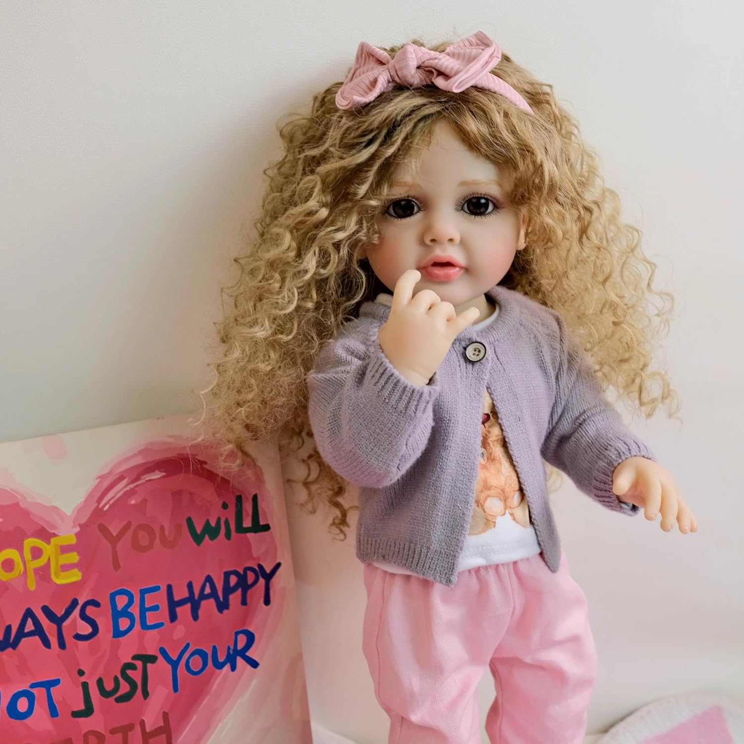 Lifelike Reborn Baby Dolls Full Body Silicone 22 inch Toddler Reborn Doll Girl Looking Real Life Realistic Newborn Baby with Curly Brown Hair Anatomically Correct Dolls Toys Age 3+
