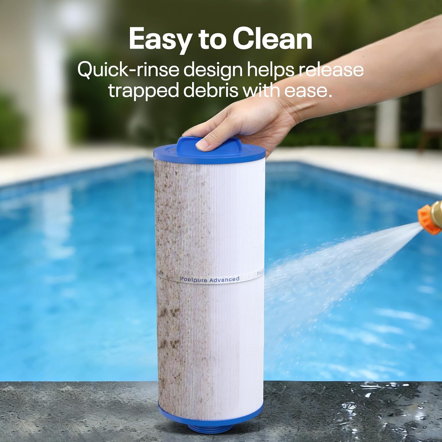 A hand holding a garden hose nozzle spraying water onto a dirty spa filter, cleaning it in a swimming pool setting.