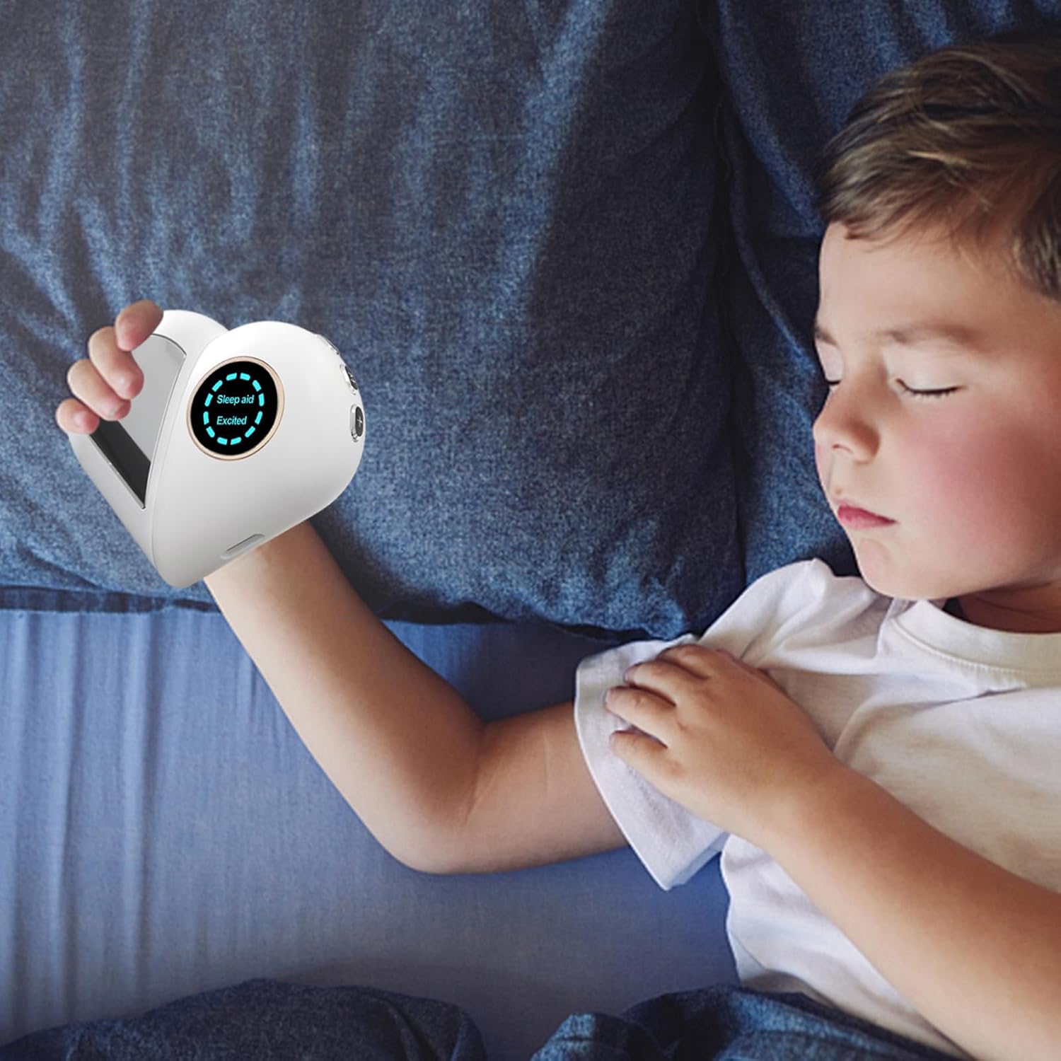A child sleeping peacefully while holding the Microcurrent Sleep Aid Device in their hand.