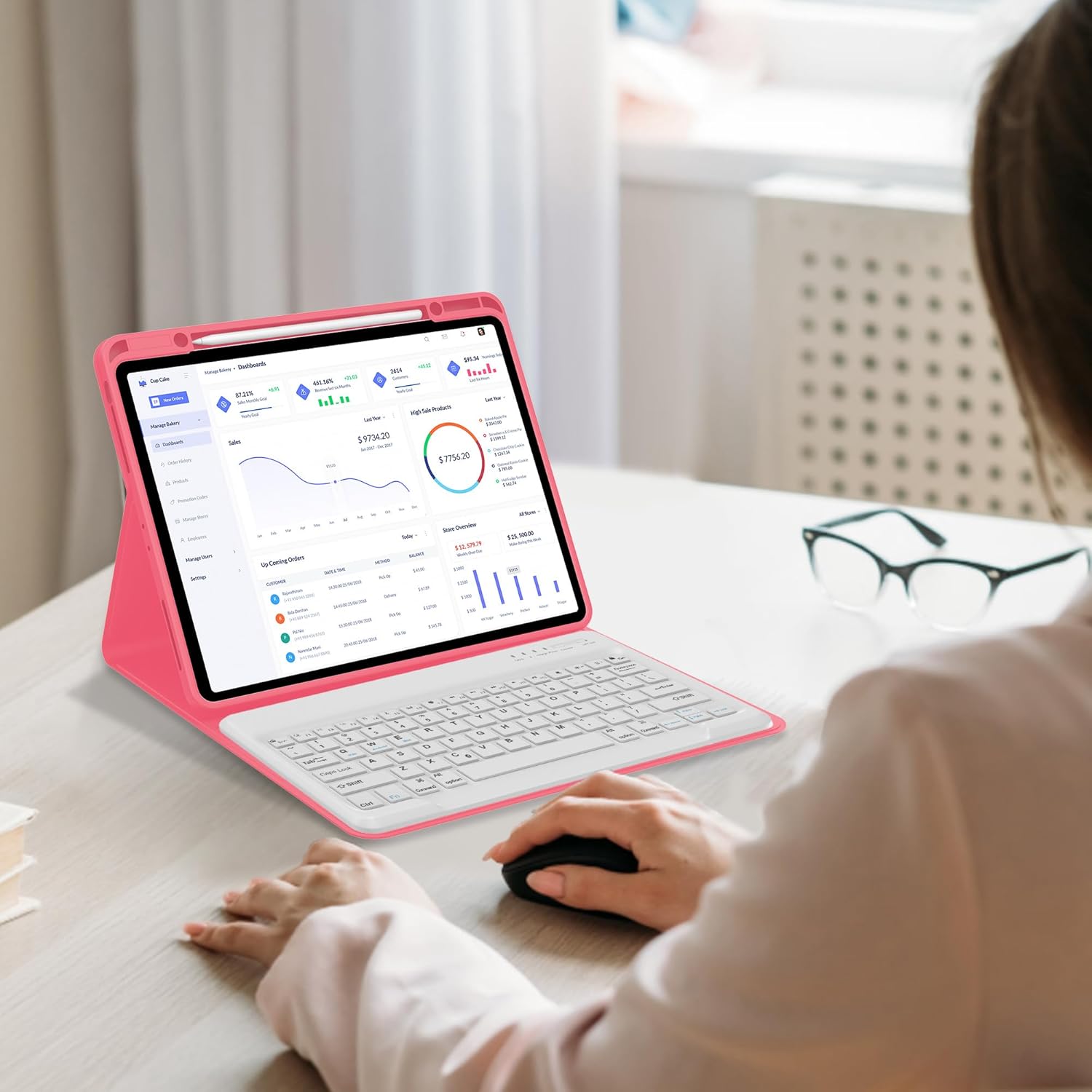 A person using the SENGBIRCH keyboard case with an iPad Pro 13-inch, typing on the keyboard with a mouse next to it, in a home office setting.