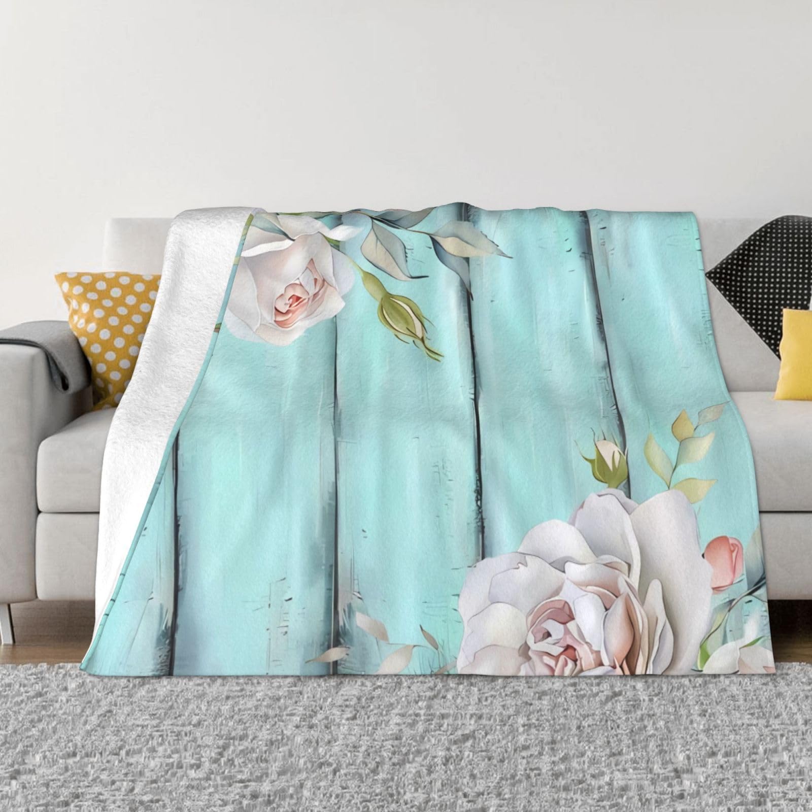 Couverture polaire grand format pour cocooning sur canapé et salon moderne