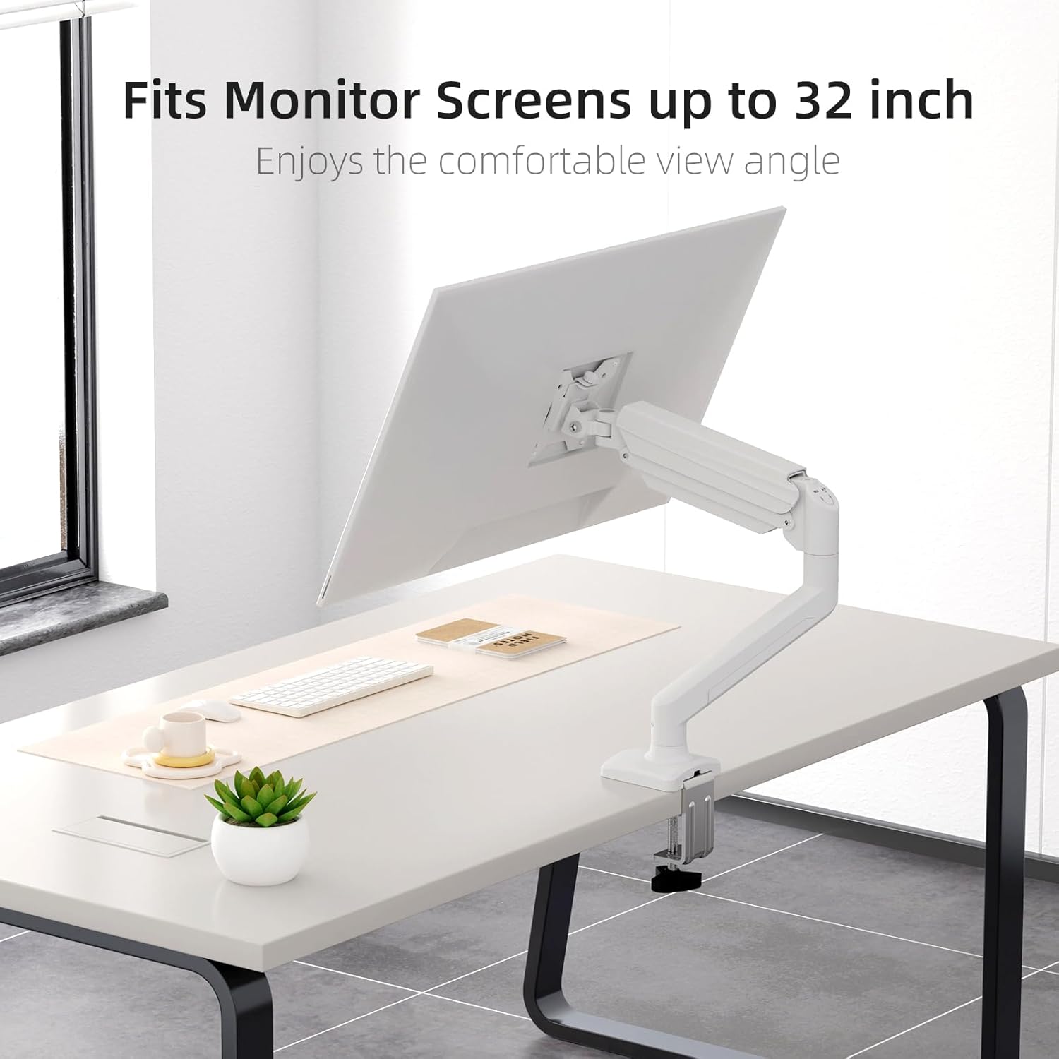 Monitor attached to the suptek monitor arm via VESA mount